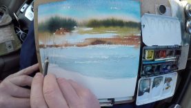 Watercolor sketching of a winter landscape on location plein air