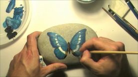 How to paint a butterfly on a sea rock