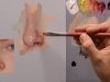 Painting a nose.